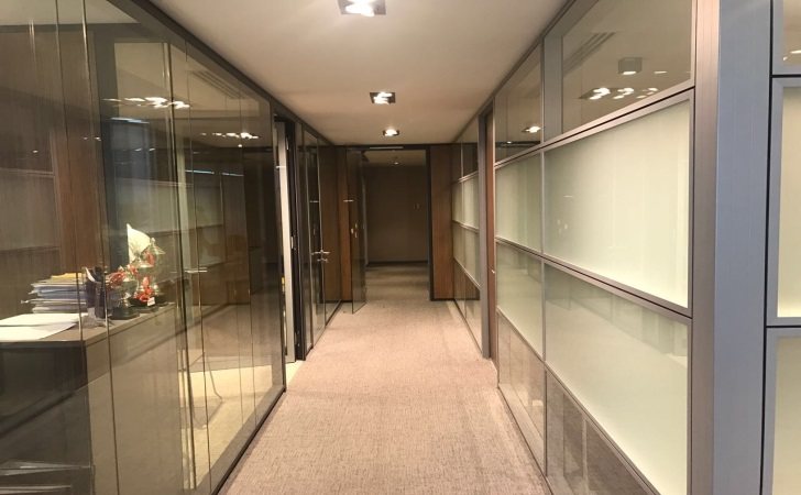 Glass partitions and corporate corridor